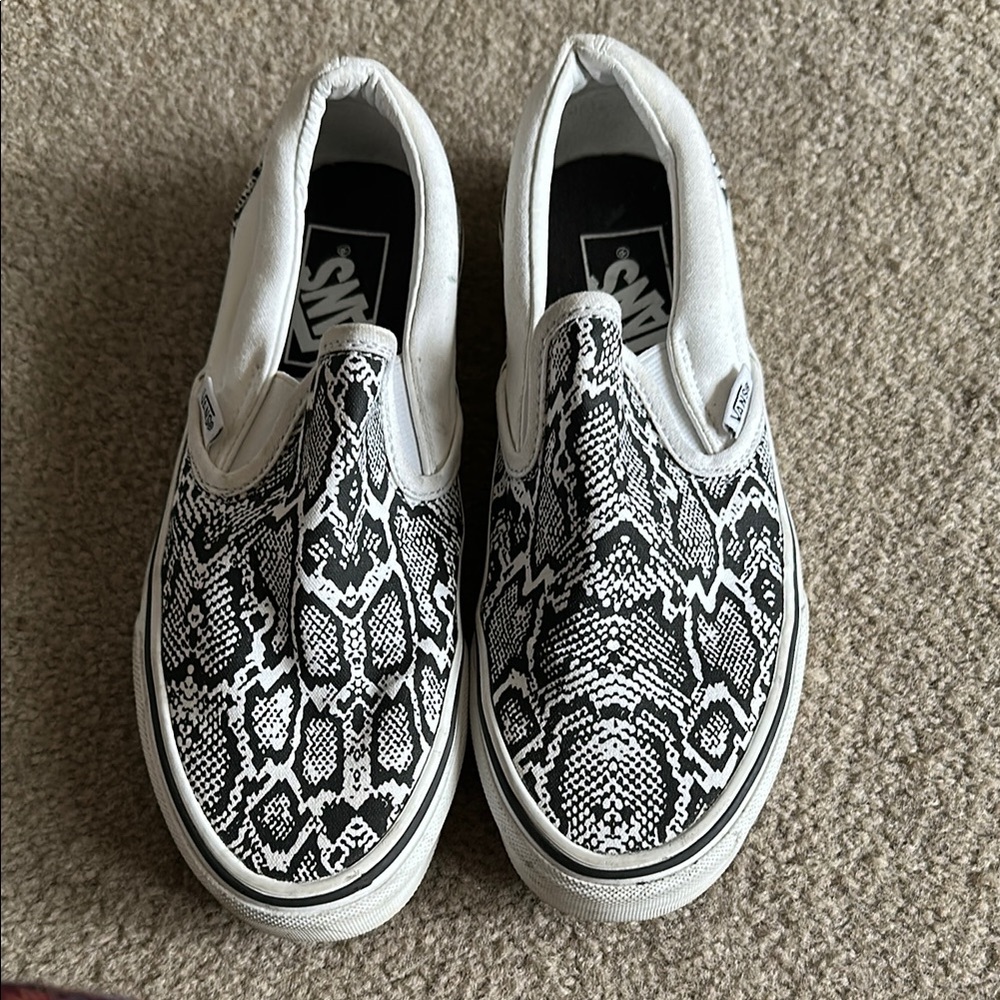 Vans Black and White Slip-On Sneakers